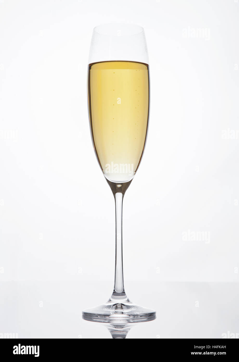 Champagne glass with bubbles on white background Stock Photo