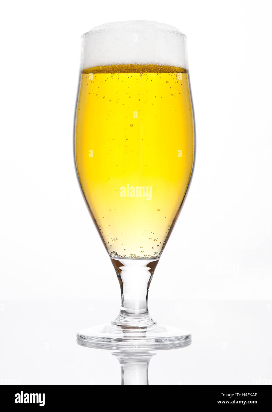 Glass of beer cider with foam golden color on white background Stock Photo