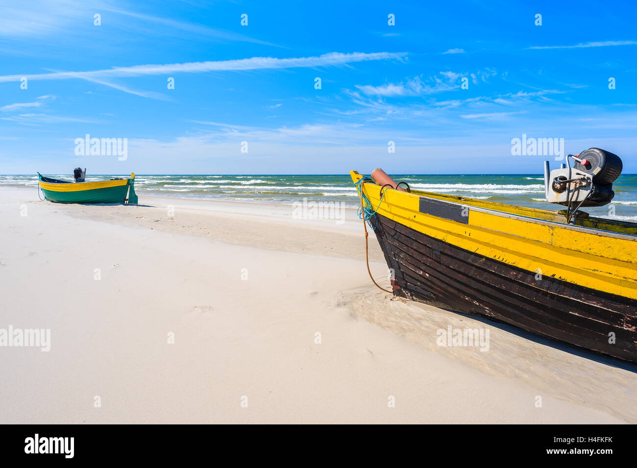 Colorful fishing boats on sandy Baltic Sea beach in Debki village, Poland Stock Photo