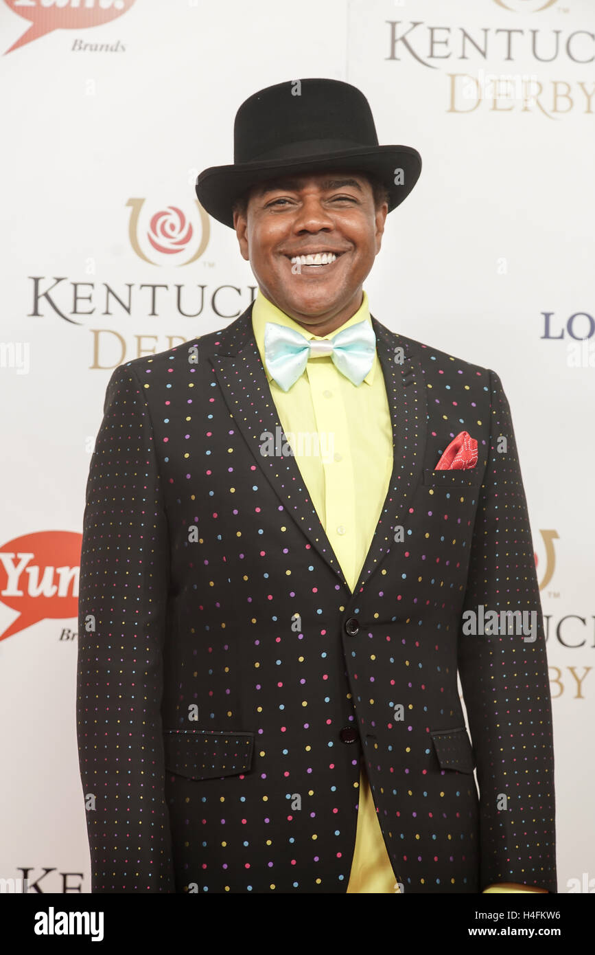 Actor Kirk KelleyKahn with black Bola hat, sparkling jacket, yellow shirt pastel blue tie smiling on the Red Carpet. Stock Photo