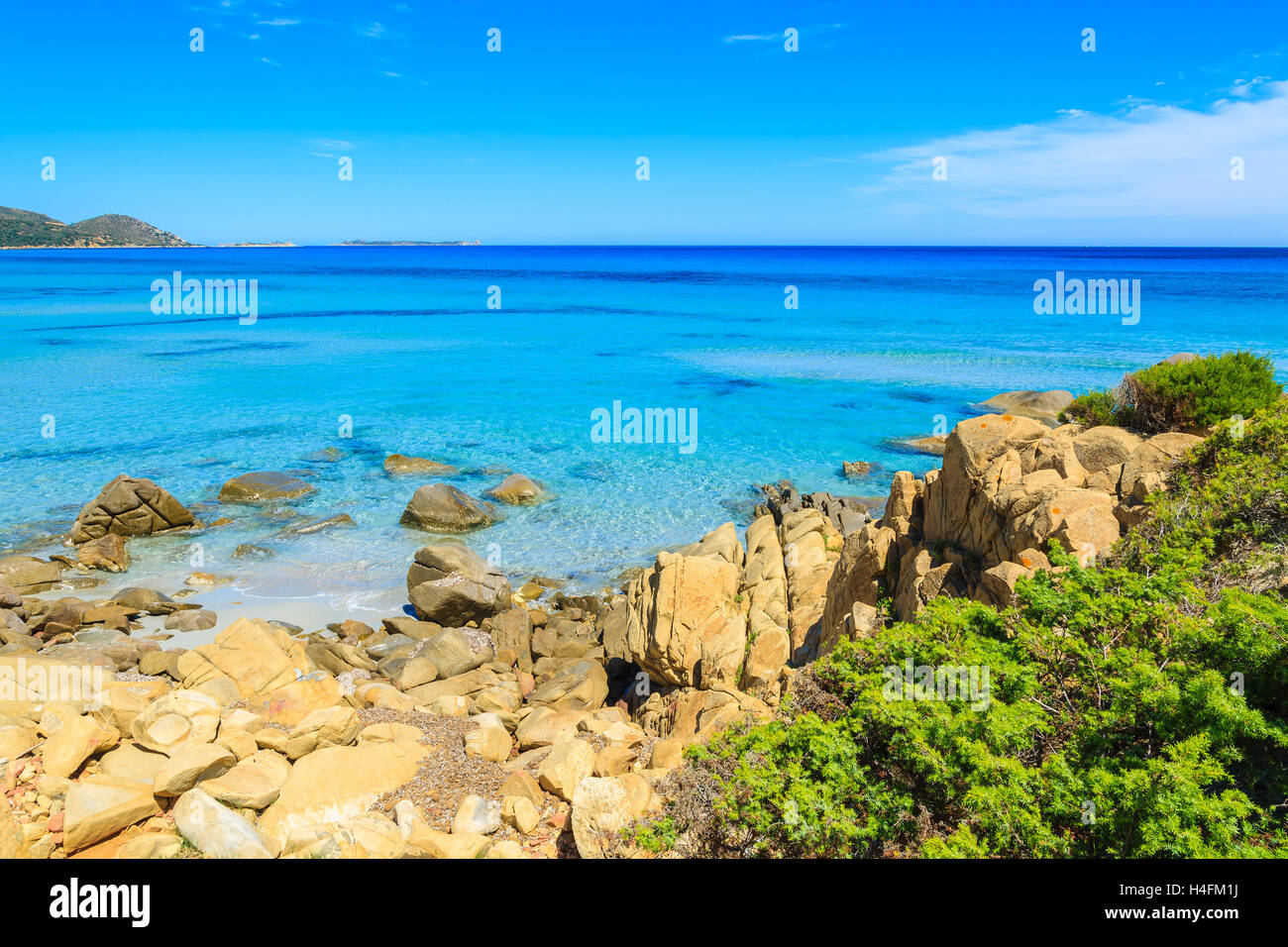 Turquoise sea water on coast of Sardinia island near Villasimius peninsula, Italy Stock Photo