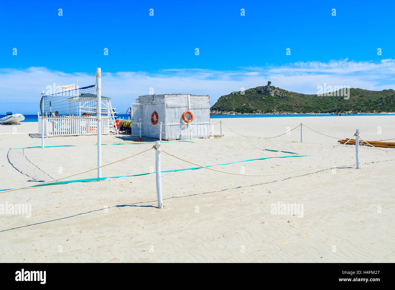 PORTO GIUNCO BEACH, SARDINIA - MAY 27, 2014: volleyball field on Porto Giunco sandy beach, Sardinia island, Italy. Volleyball is a popular sport to play on a beach. Stock Photo