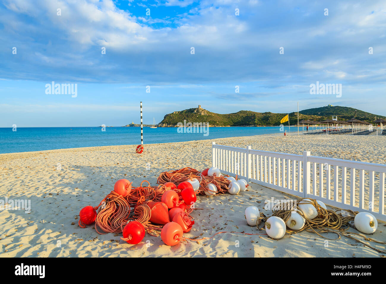 Swimming net with red buoys on sandy Porto Giunco beach, Villasimius, Sardinia island, Italy Stock Photo
