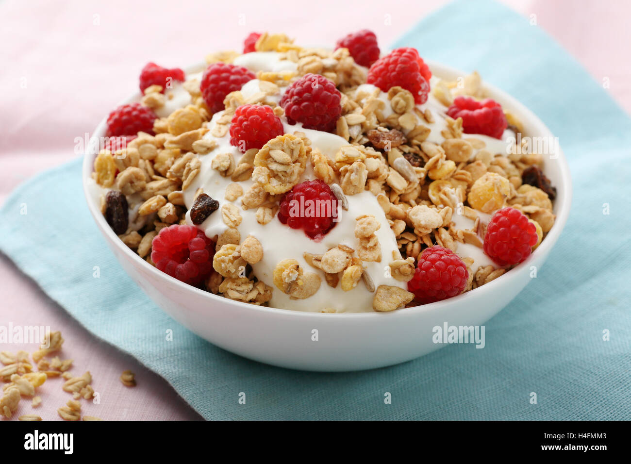 Breakfast granola with raspberry, food close-up Stock Photo