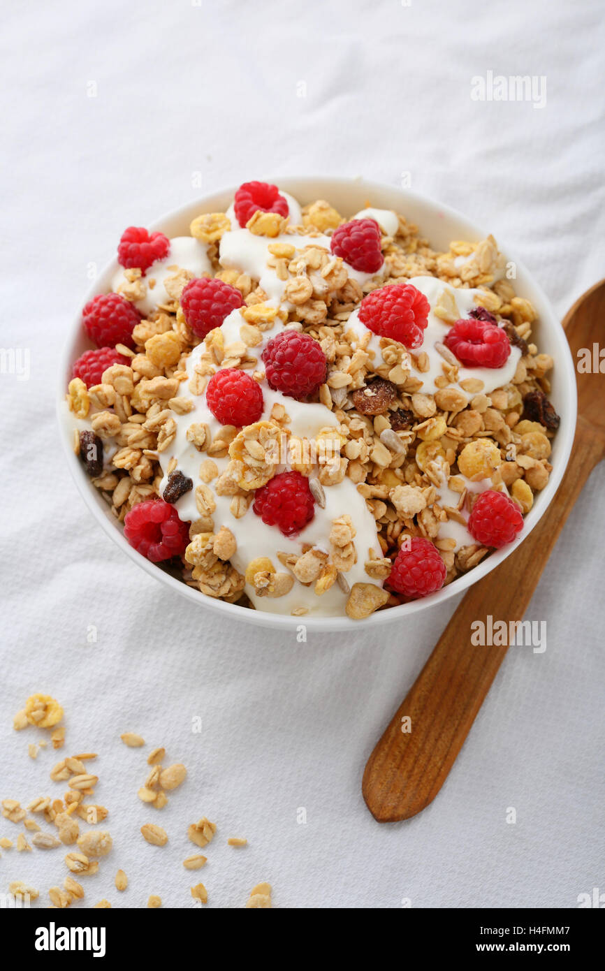 Breakfast muesli with raspberry, food closeup Stock Photo