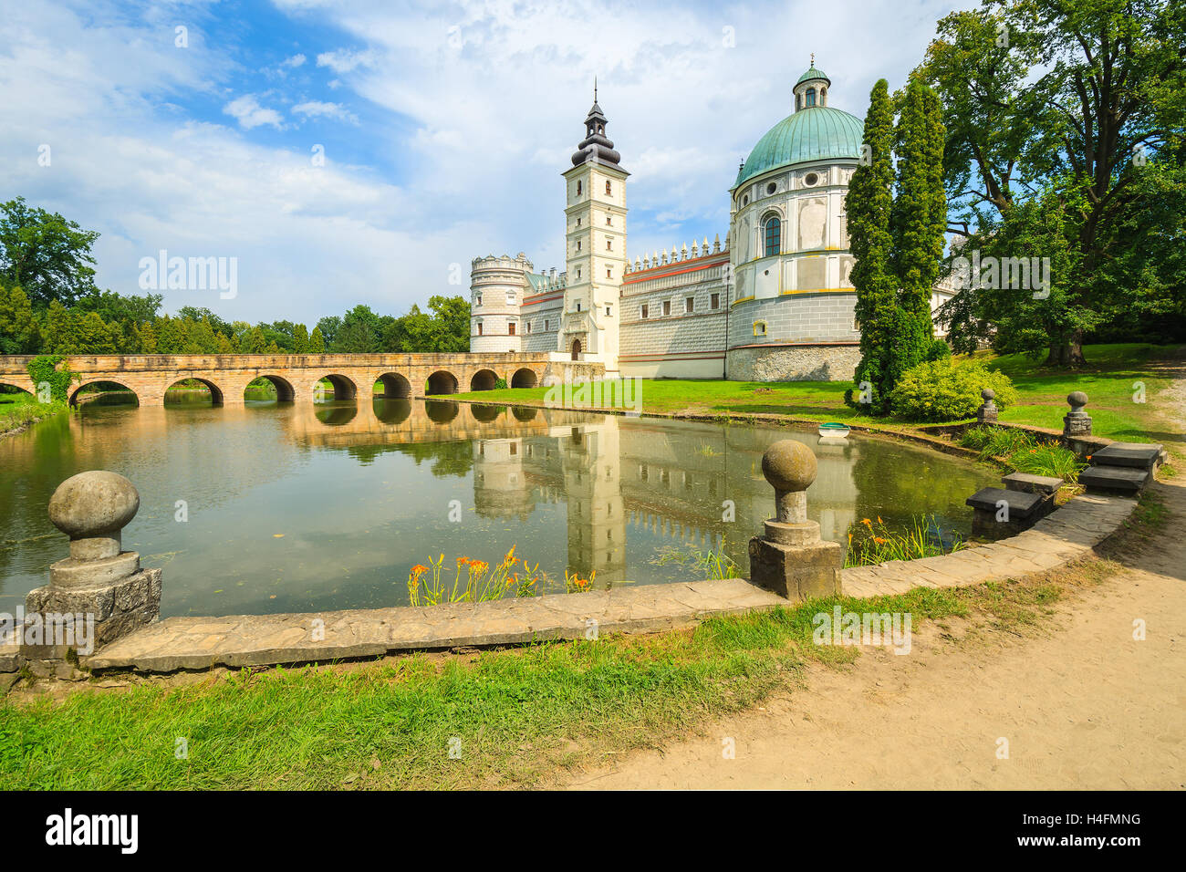 Beautiful Krasiczyn castle and lake on a sunny summer day, Poland Stock Photo