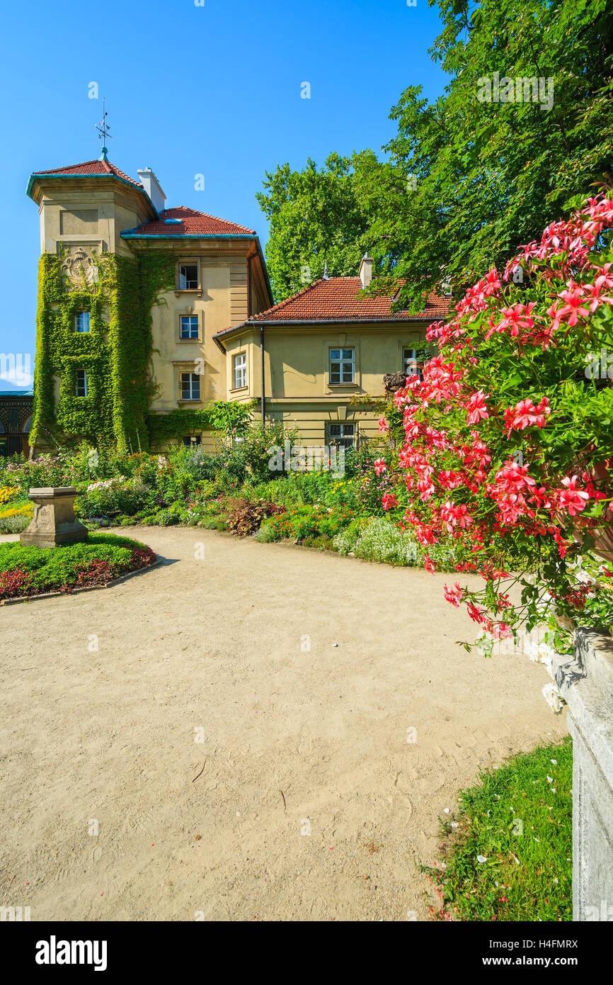 Flowers in gardens of beautiful Lancut castle on sunny summer day, Poland Stock Photo