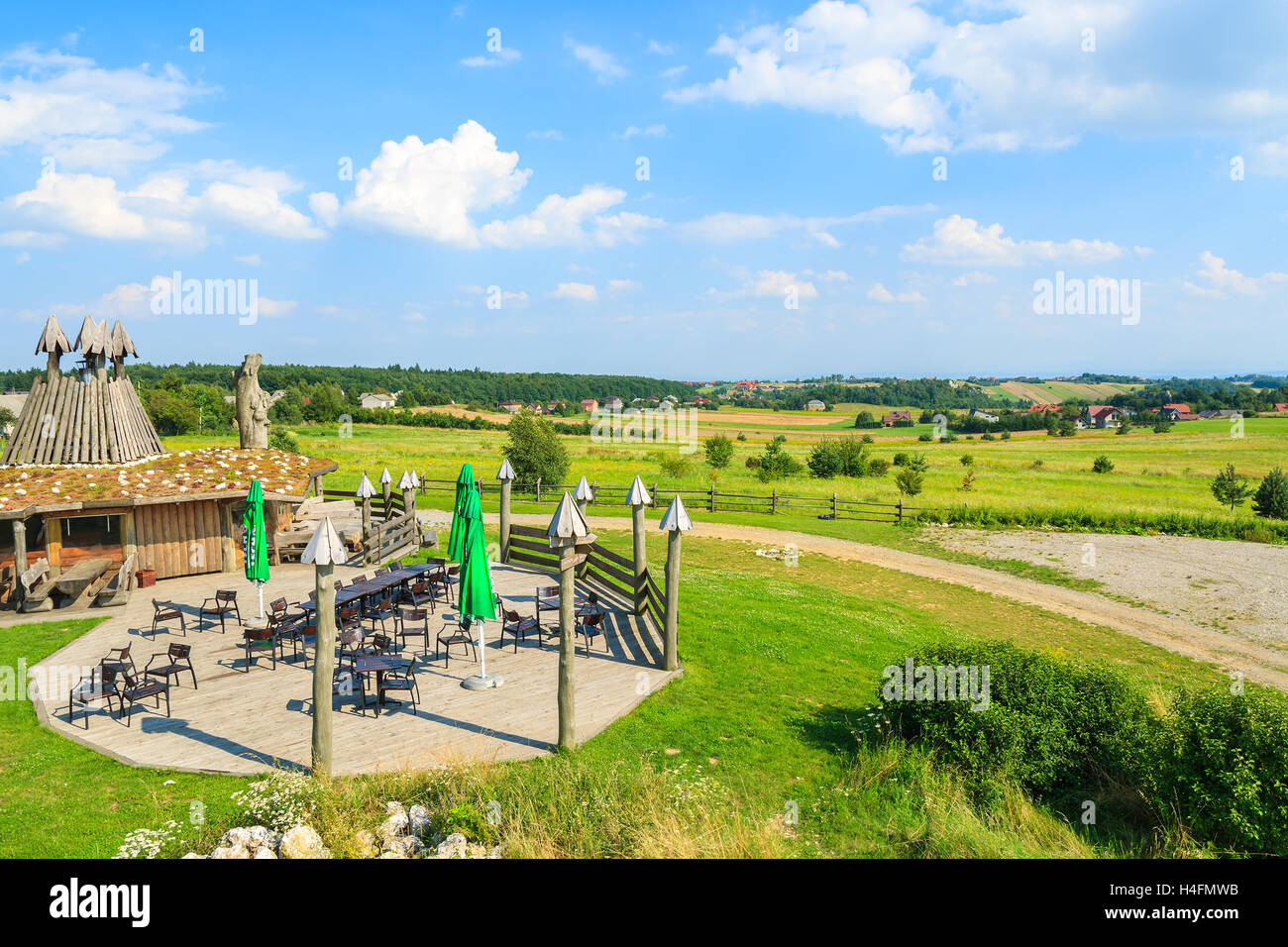 JERZMANOWICE VILLAGE, POLAND - AUG 9, 2014: view of a restaurant near Krakow on sunny summer day, Poland. Rural areas are popular for dining during weekends among Poles. Stock Photo