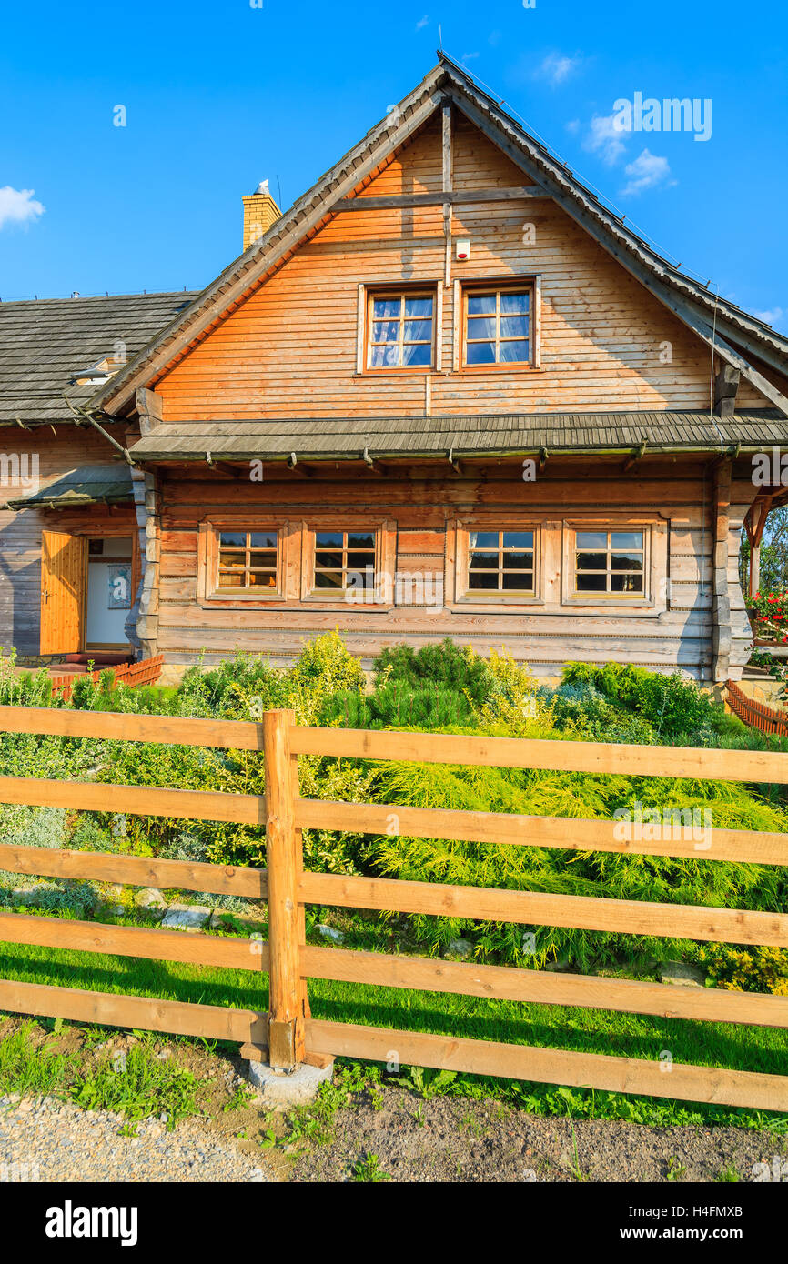 Traditional house built in mountain style in countryside area near