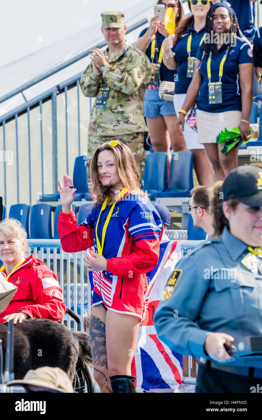 Elizabeth Marks, of the USA, waves to the crowd after receiving a gold medal for her victory in the Women's 50 LC Meter Backstroke ISB during the swimming competition of the Invictus Games on May 11, 2016 at the ESPN Wide World of Sports Complex in Orland Stock Photo