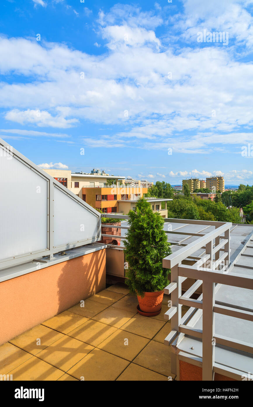 Terrace of new city apartment with beautiful clouds on blue sky, Krakow, Poland Stock Photo