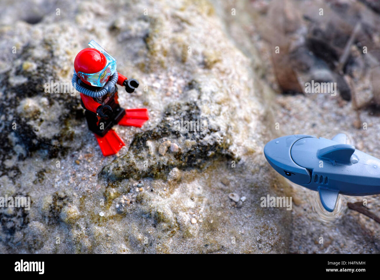 Paphos, Cyprus - October 09, 2016 Lego scuba diver and shark on seafloor. Stock Photo