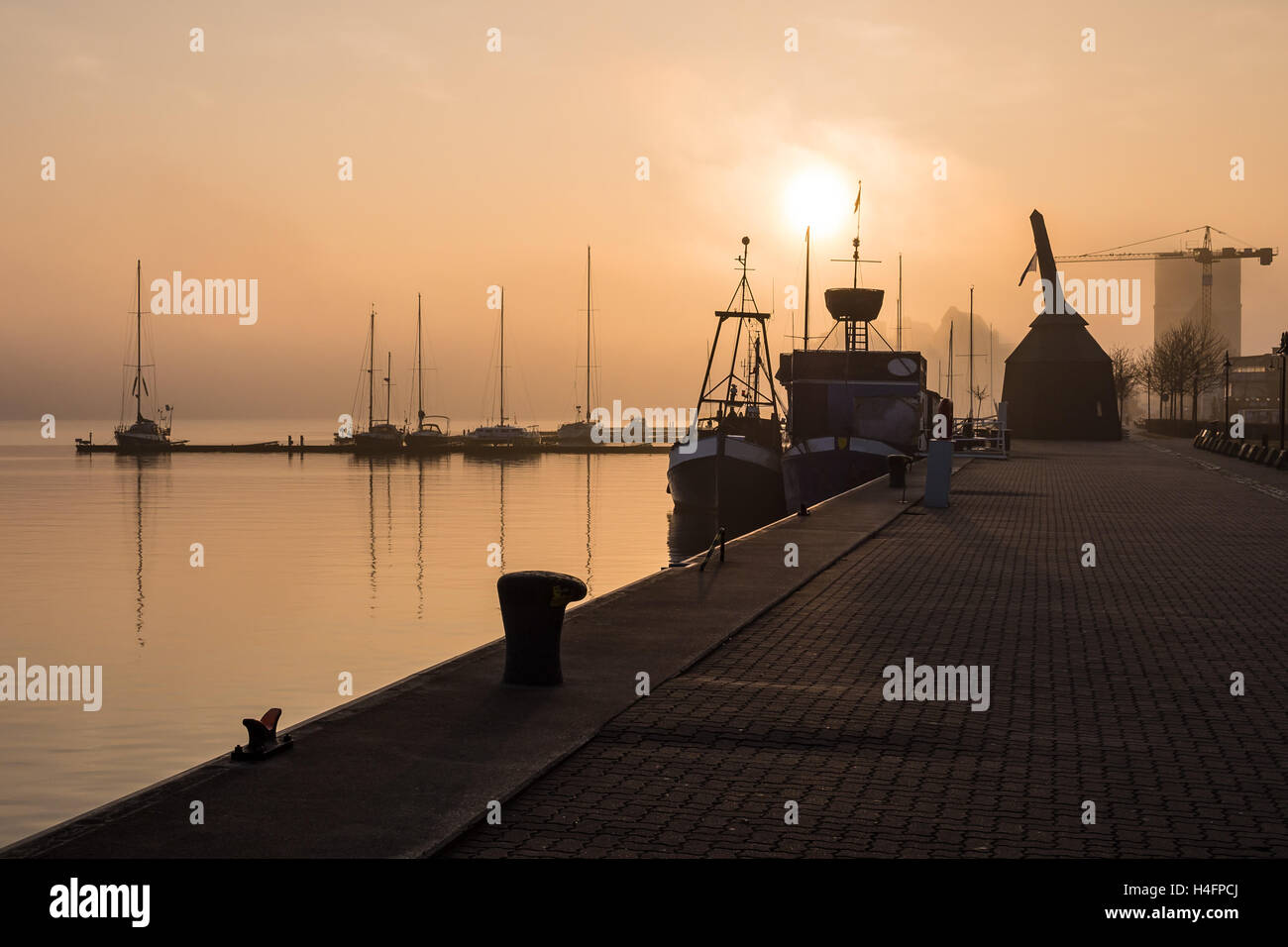 Sunrise in the city port of Rostock, Germany Stock Photo