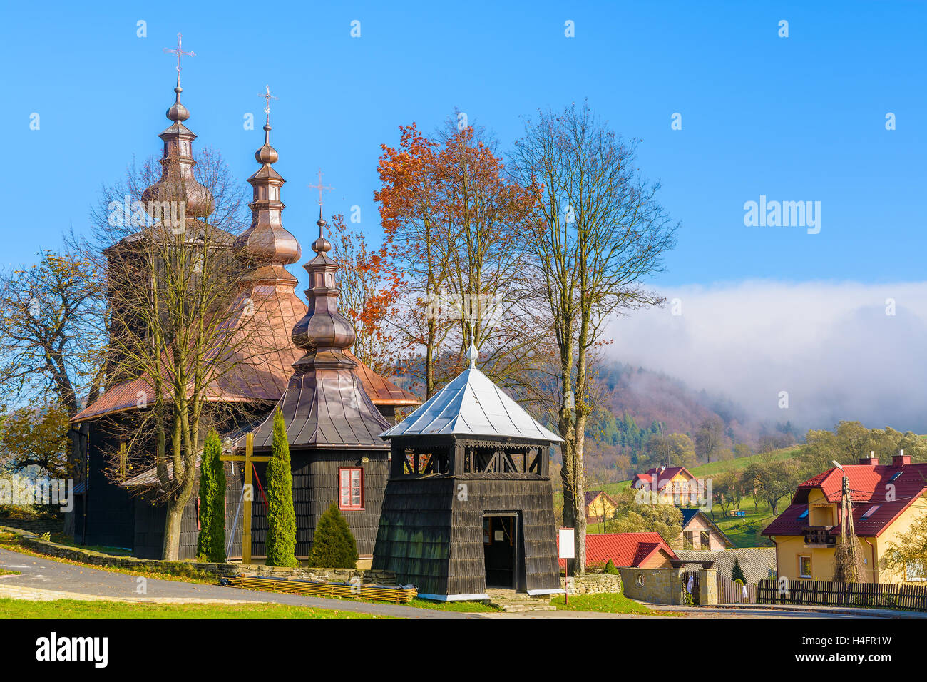 Old wooden orthodox catholic church in Banica village on sunny autumn day, Beskid Niski Mountains, Poland Stock Photo