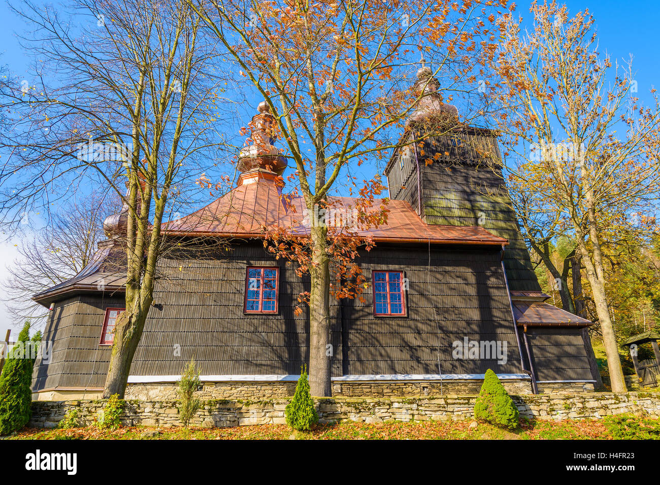 Old wooden orthodox catholic church in Banica village on sunny autumn day, Beskid Niski Mountains, Poland Stock Photo
