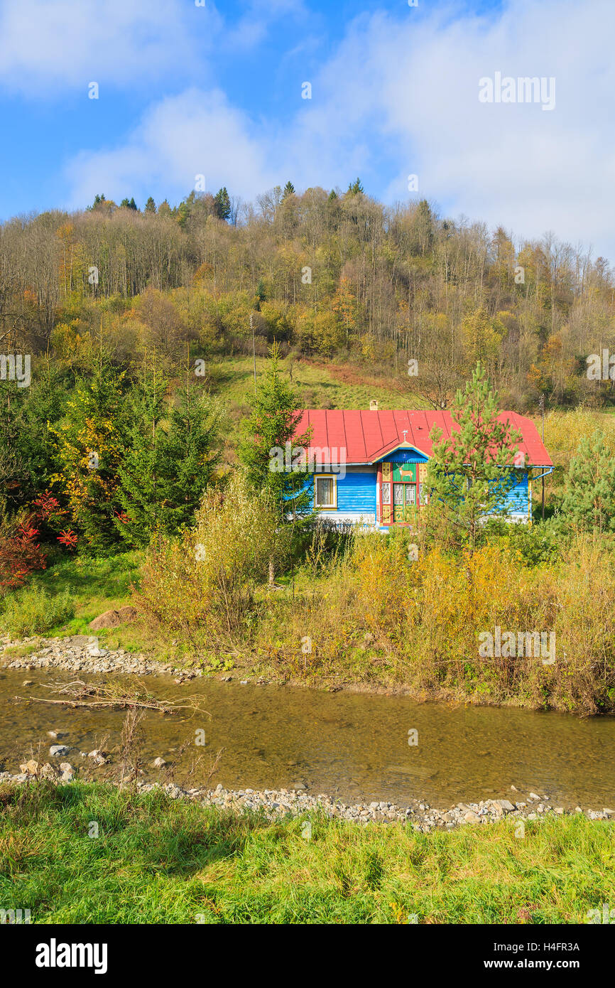 Traditional house in Beskid Niski Mountains on sunny autumn day, Poland Stock Photo