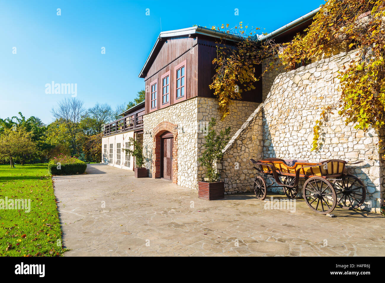 Traditional house in Tomaszowice village park on sunny autumn day, Poland Stock Photo