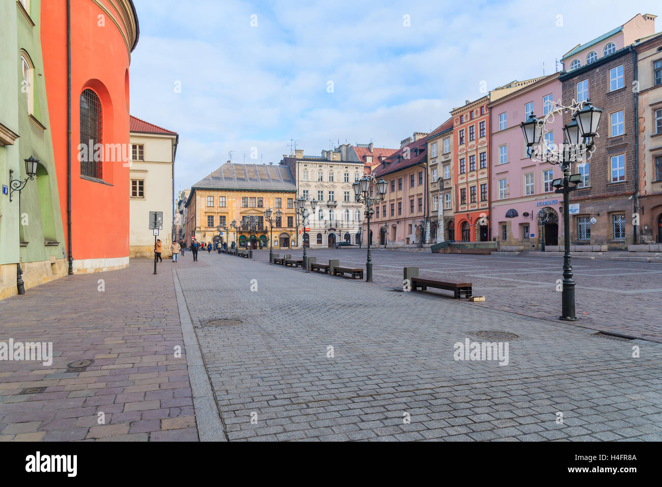 KRAKOW, POLAND - DEC 10, 2014: colourful houses on square in Krakow. Many tourists visit Krakow which is most popular destination in Poland. Stock Photo