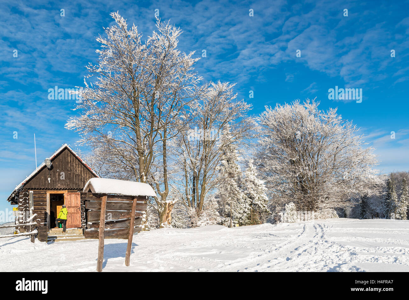 Mountain hut in Beskid Sadecki Mountains on sunny winter day, Poland Stock Photo