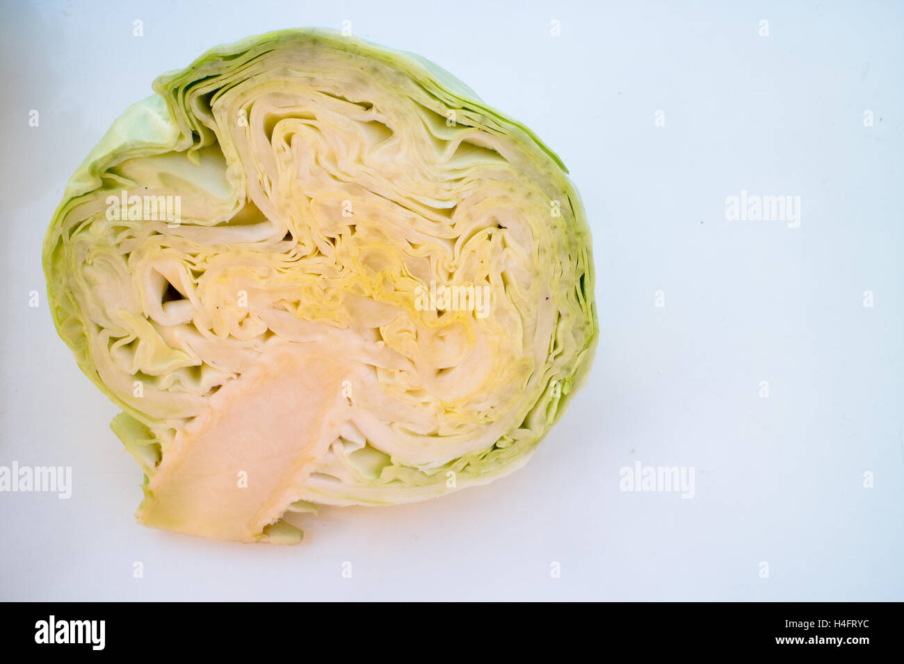 Half of a Green cabbage eating local from a farm, farm inspired Stock Photo