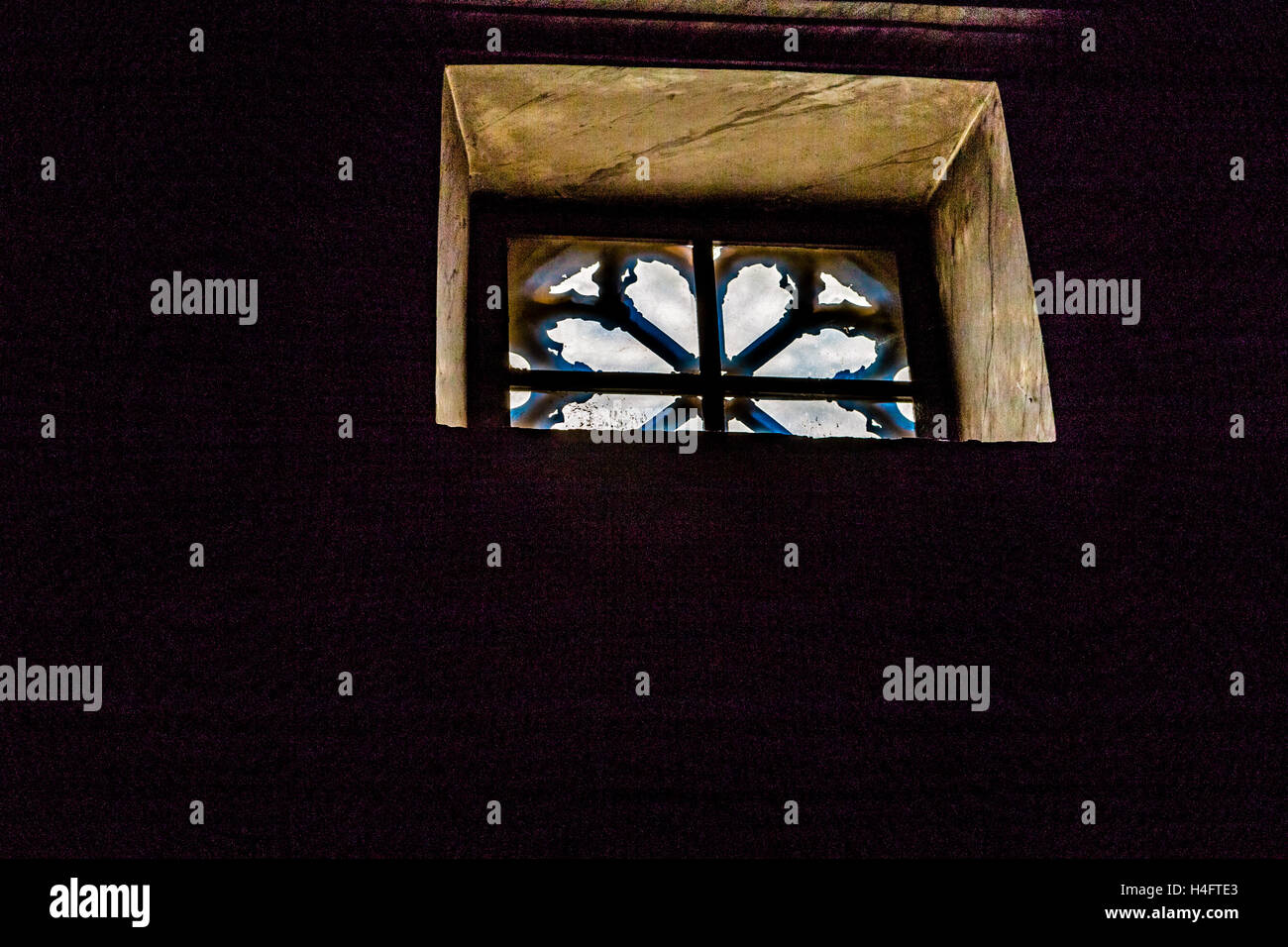 ancient window with iron grating Stock Photo