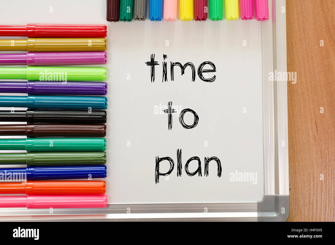 Felt-tip pen and whiteboard on a wooden background and time to plan text concept Stock Photo