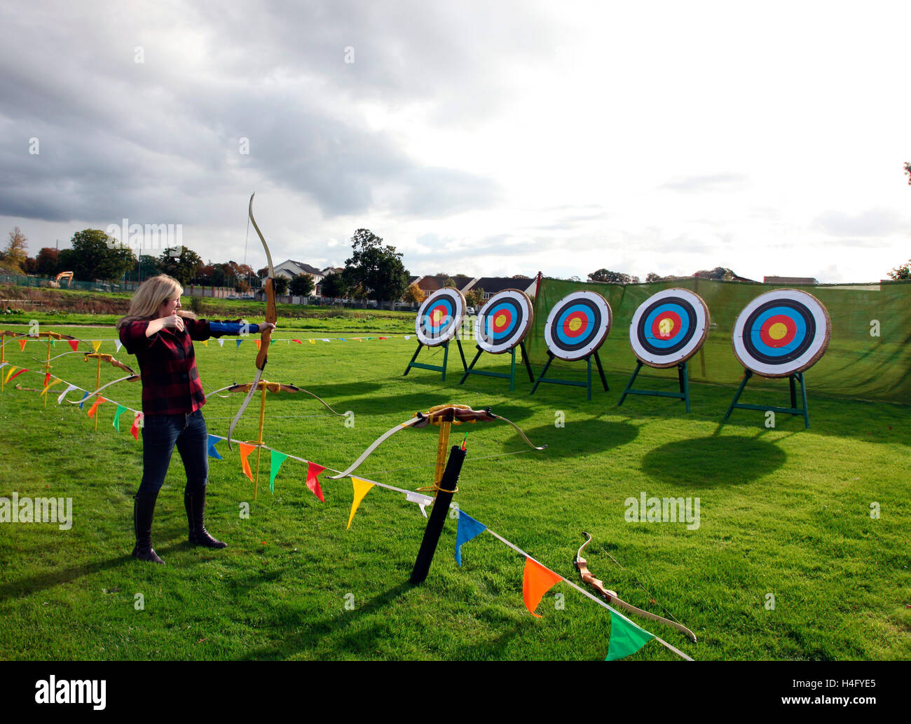 woman archer lets fly at Dunboyne Castle Hotel Stock Photo