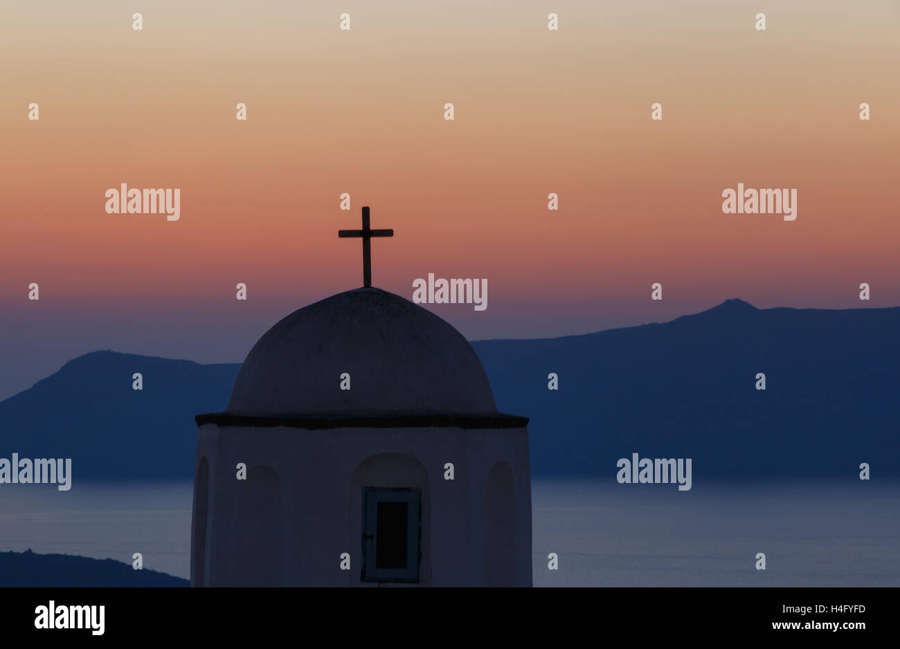 dome of church on Santorini at sunset Stock Photo