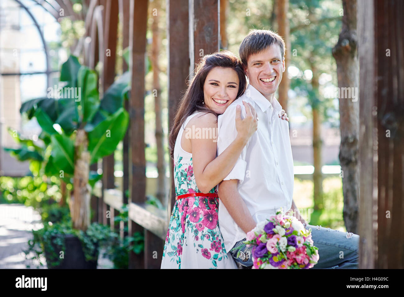 young couple walking and hugging in the park Stock Photo - Alamy