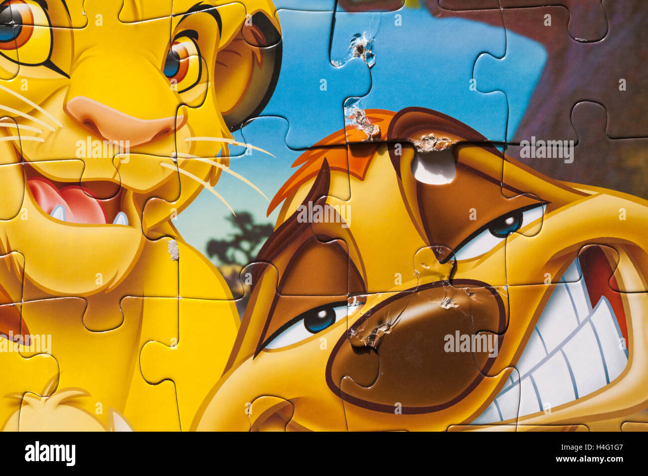 Disney store the Lion King jigsaw puzzle with pieces chewed by hungry pet Stock Photo