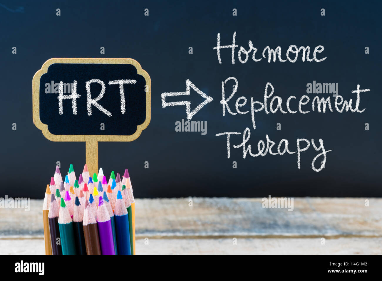 Business Acronym HRT Hormone Replacement Therapy written with chalk on