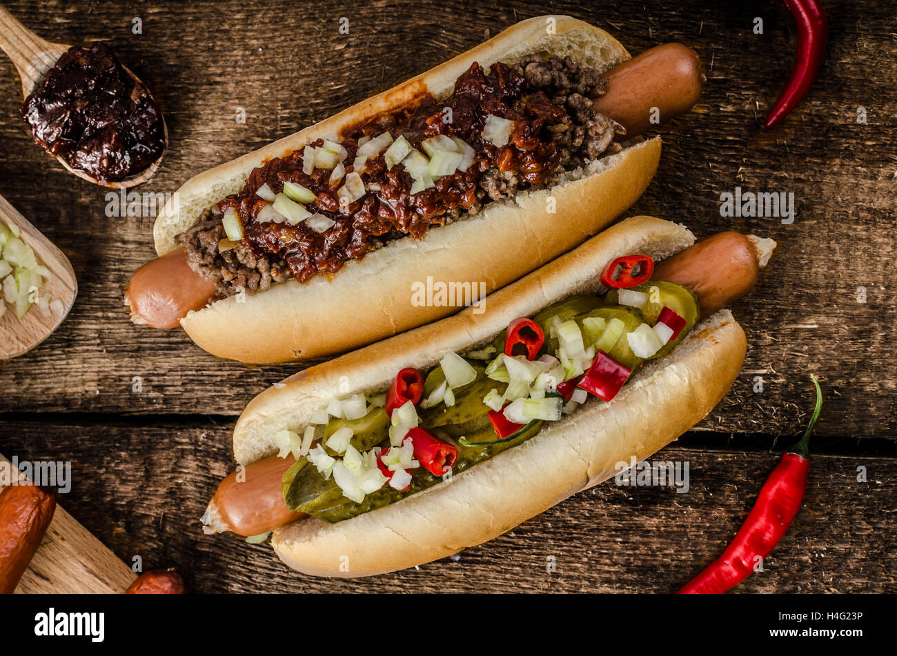 Chilli and vegetarian hot dog, home pickles, beef meat and homemade barbeque souce Stock Photo