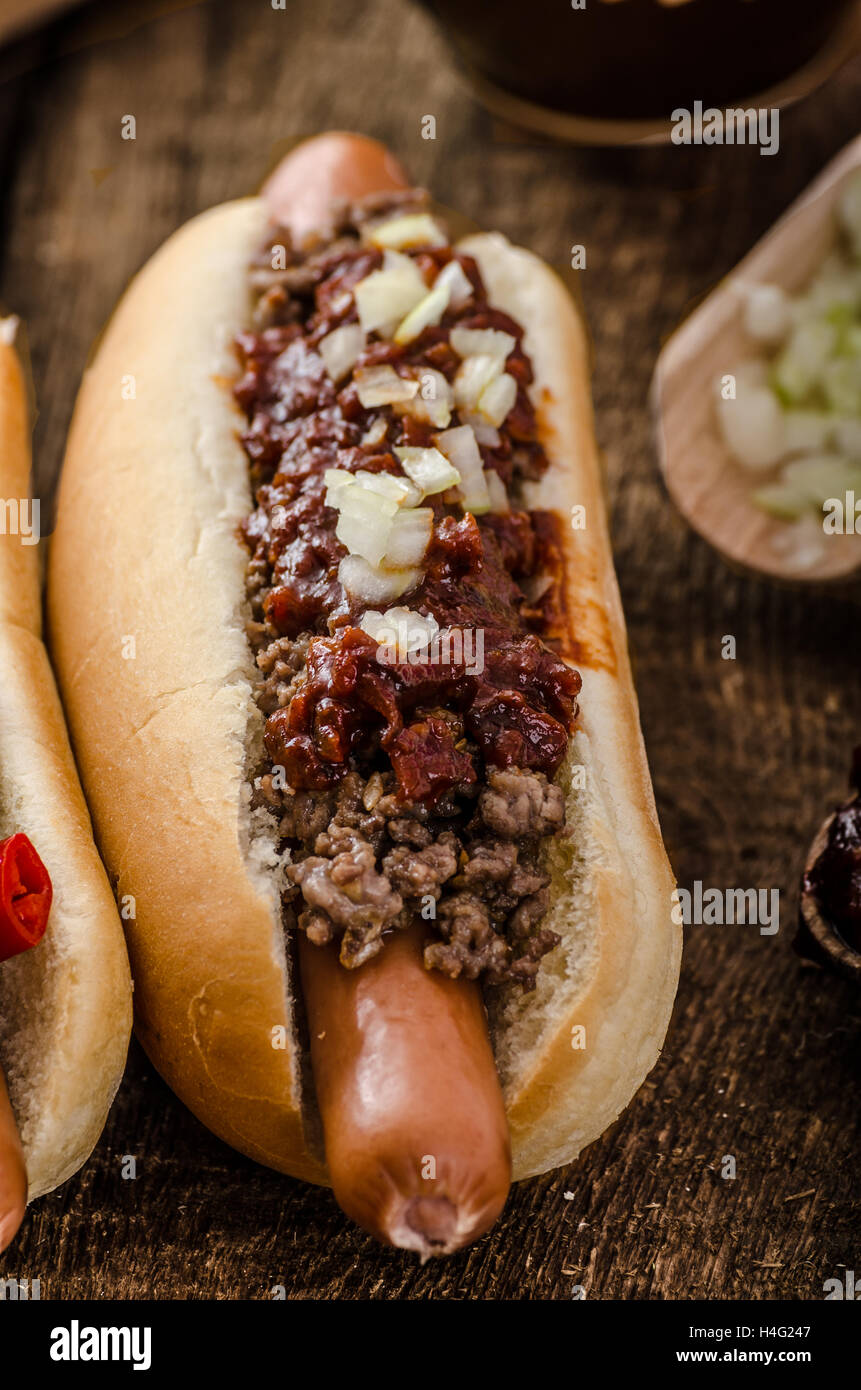 Chilli and vegetarian hot dog, home pickles, beef meat and homemade barbeque souce Stock Photo