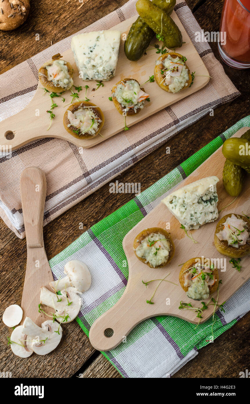 Mushrooms stuffed with blue cheese, microgreens on top, simple