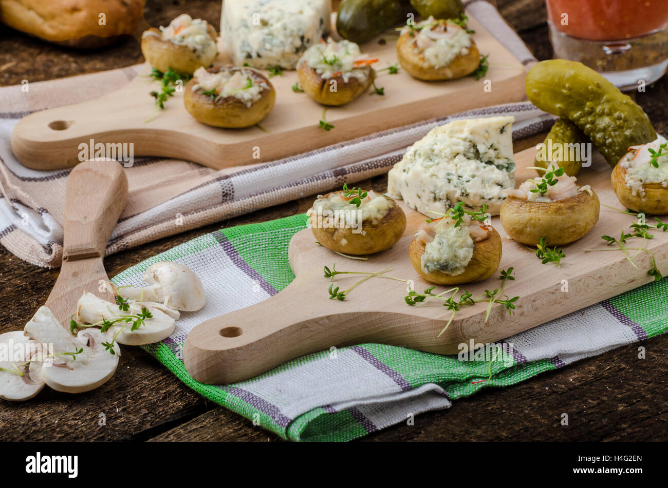 Mushrooms stuffed with blue cheese, microgreens on top, simple