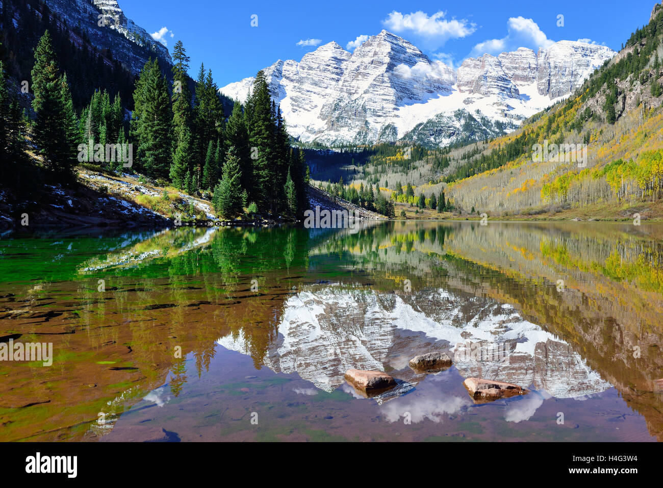 landscape view of the Maroon Bells during foliage season with snow ...