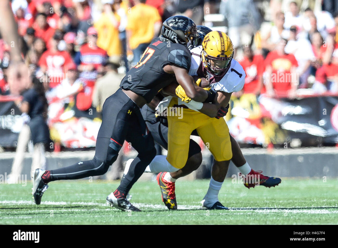 College Park, Maryland, USA. 15th Oct, 2016. University of Minnesota player RODNEY SMITH (1) is tackled by University of Maryland cornerback TINO ELLIS (17) at the Capital One Field at Maryland Stadium, College Park, Maryland. © Amy Sanderson/ZUMA Wire/Alamy Live News Stock Photo