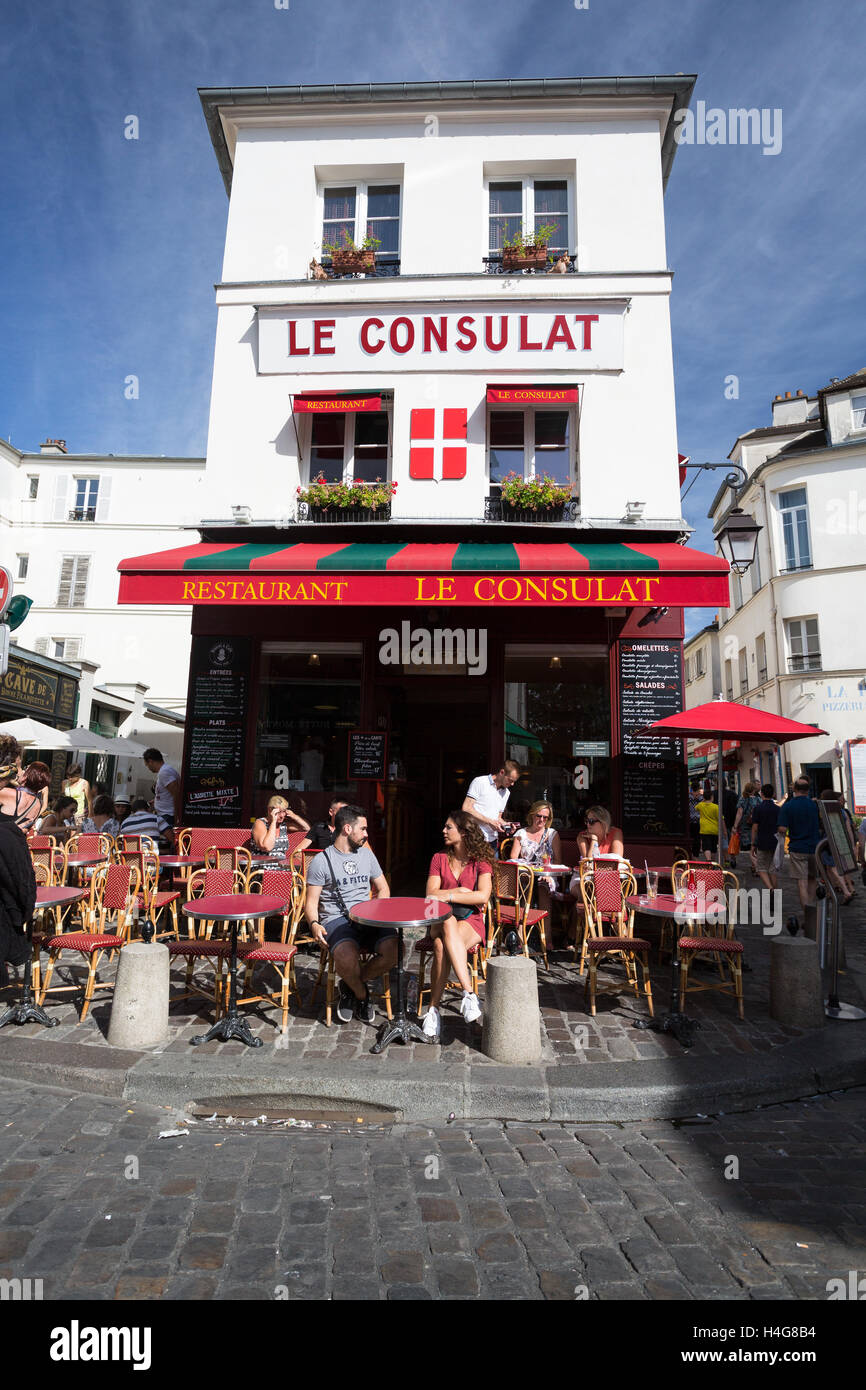 PARIS - AUGUST 14: View of typical paris cafe on August 14 2016 in Paris. Montmartre area is among most popular destinations in Paris Le Consulat is a typical cafe. Stock Photo