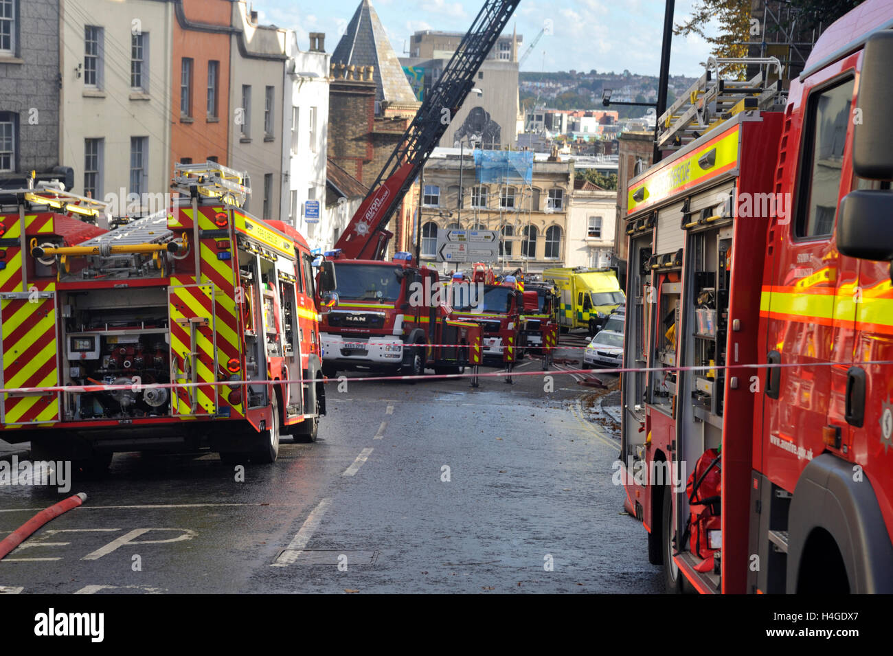 Bristol, UK. 16th October, 2016. St Michael's on the Mount Church Without, a grade II listed building from the seventeen hundreds in central Bristol, England, UK, located on St Michael's Hill,  16 October 2016.  Multiple fire engines including two ladder rigs, a number of ambulances and police attended the fire. The church has been boarded up for 17 years with temporary uses during this time but had squatters and graffiti taggers broke in a few days ago.  The roof and much of interior has been destroyed. The cause of the fire is not yet known. Credit: Charles Stirling/Alamy Live News Stock Photo