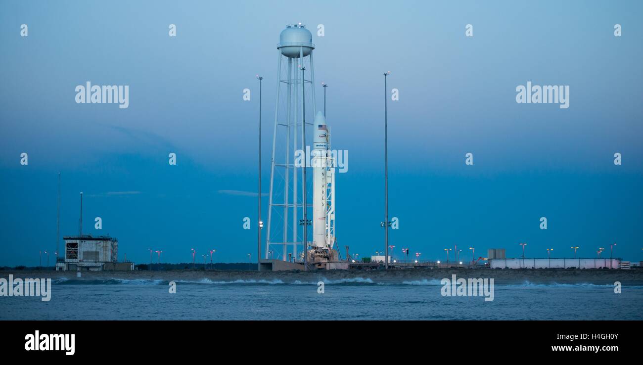 Wallops, Virginia, USA. 15th Oct, 2016. The Orbital ATK Antares rocket with the Cygnus spacecraft onboard, is in ready position at launch Pad-0A in early dawn at NASA Wallops Flight Facility October 15, 2016 in Wallops, Virginia. The Antares will launch with the Cygnus spacecraft filled with over 5,100 pounds of supplies for the International Space Station. Credit:  Planetpix/Alamy Live News Stock Photo