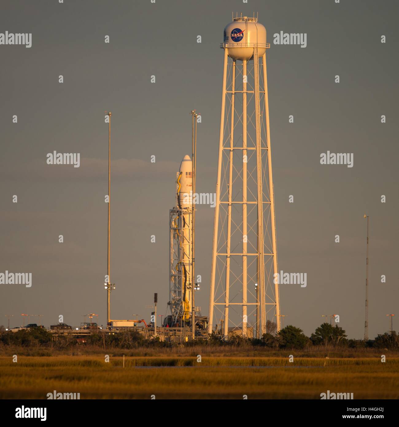 Wallops, Virginia, USA. 15th Oct, 2016. The Orbital ATK Antares rocket with the Cygnus spacecraft onboard, is in ready position at launch Pad-0A, at NASA Wallops Flight Facility October 14, 2016 in Wallops, Virginia. The Antares will launch with the Cygnus spacecraft filled with over 5,100 pounds of supplies for the International Space Station. Credit:  Planetpix/Alamy Live News Stock Photo