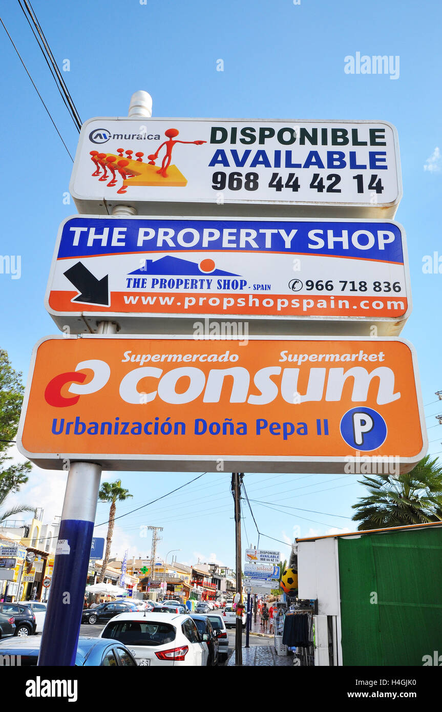 Advertising signs in the Spanish town of Ciudad Quesada, including a property firm. The area is popular for British ex-pats Stock Photo