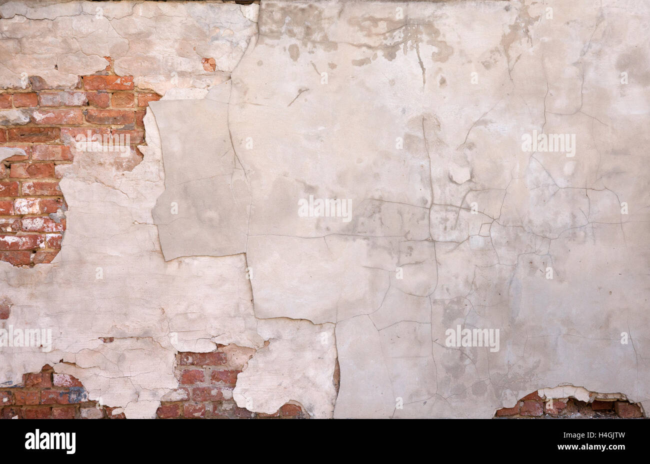 'Painted Wall Background #1'  Plastered painted wall with exposed brick. Stock Photo