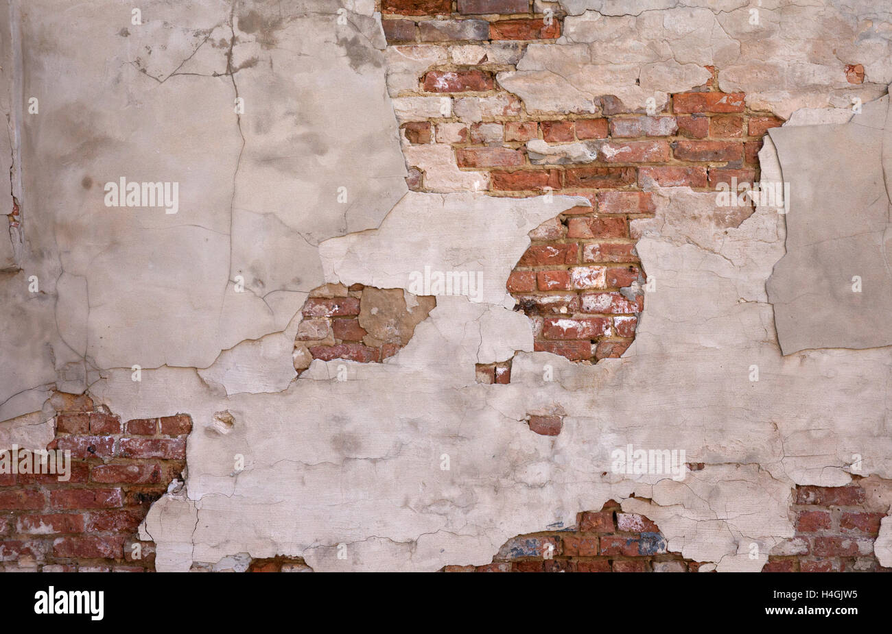 "Painted Wall Background #2"   Painted plastered wall with exposed brick. Stock Photo