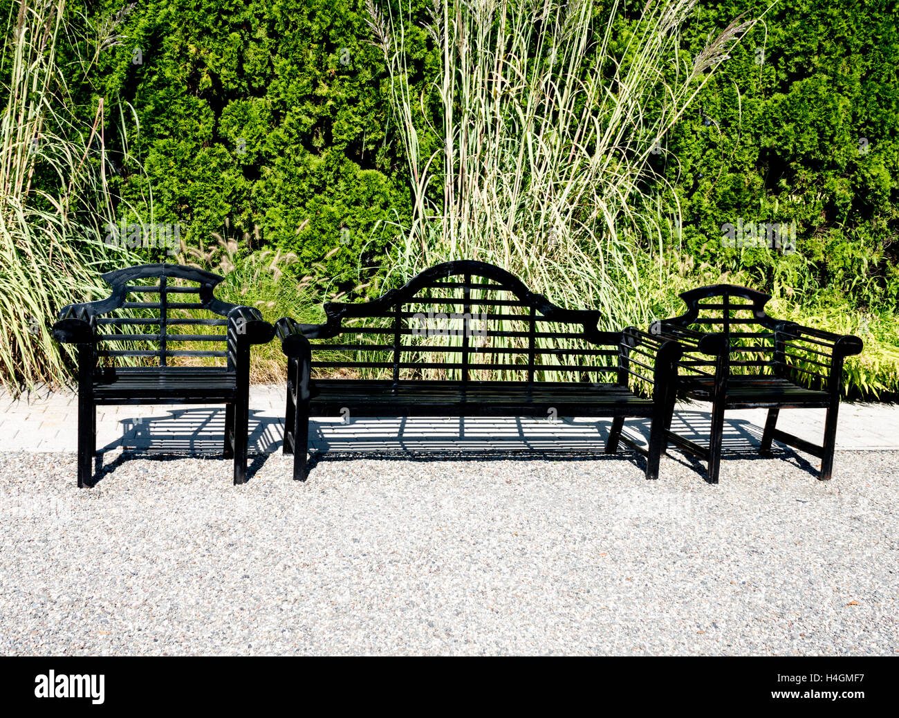 Black benches in the park of Grounds for Sculpture in Hamilton, NJ. Stock Photo