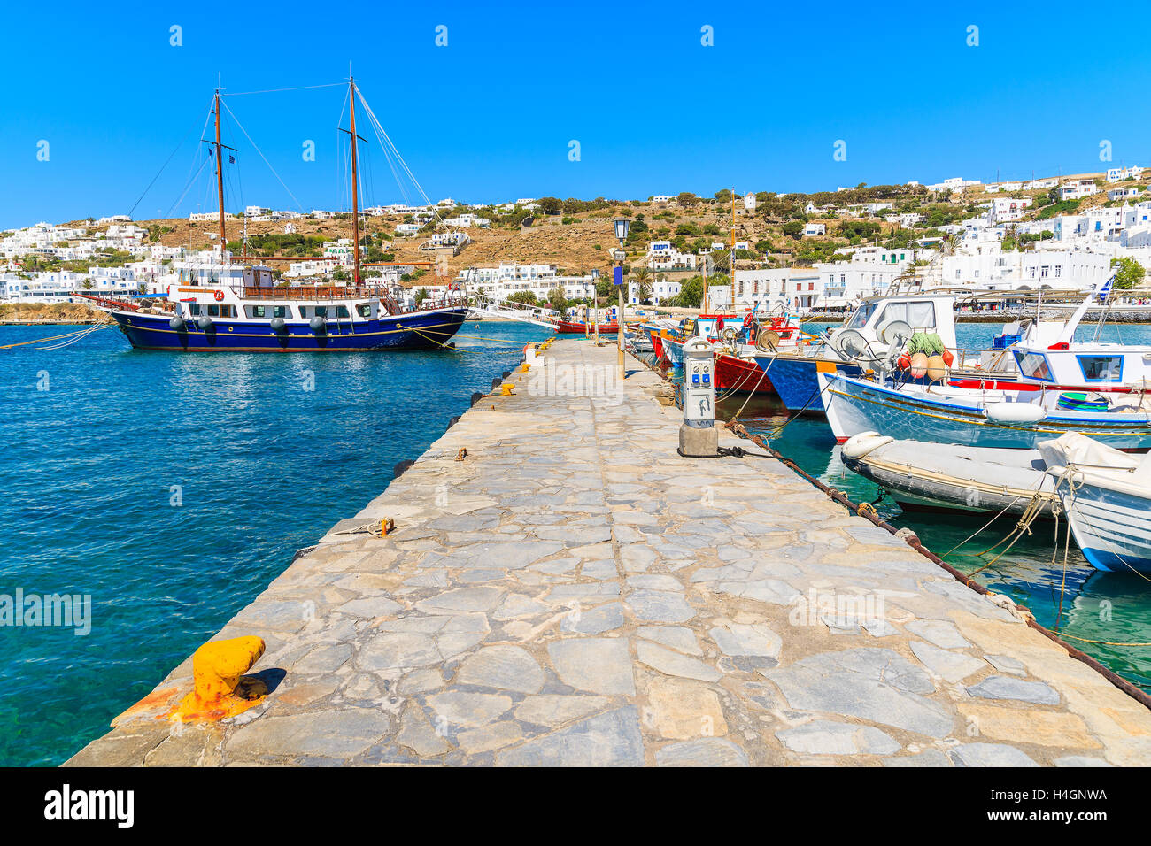 Boats mooring at pier in Mykonos port, Cyclades islands, Greece Stock Photo