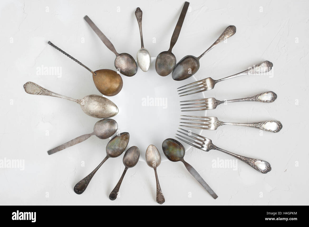Silverware on the white plate Stock Photo