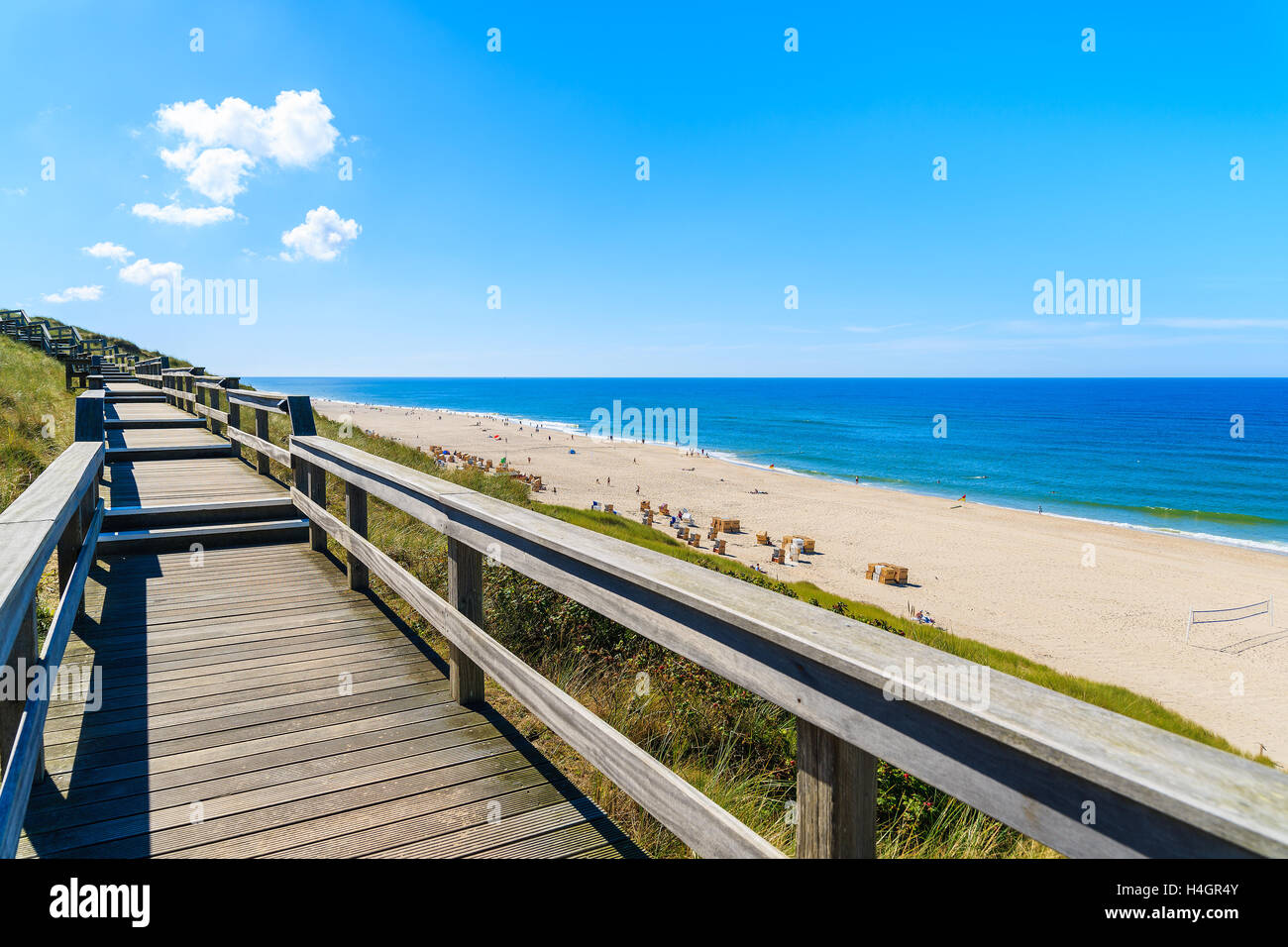 Wooden walkway on sand dune overlooking beach in Wenningstedt, Sylt island, Germany Stock Photo