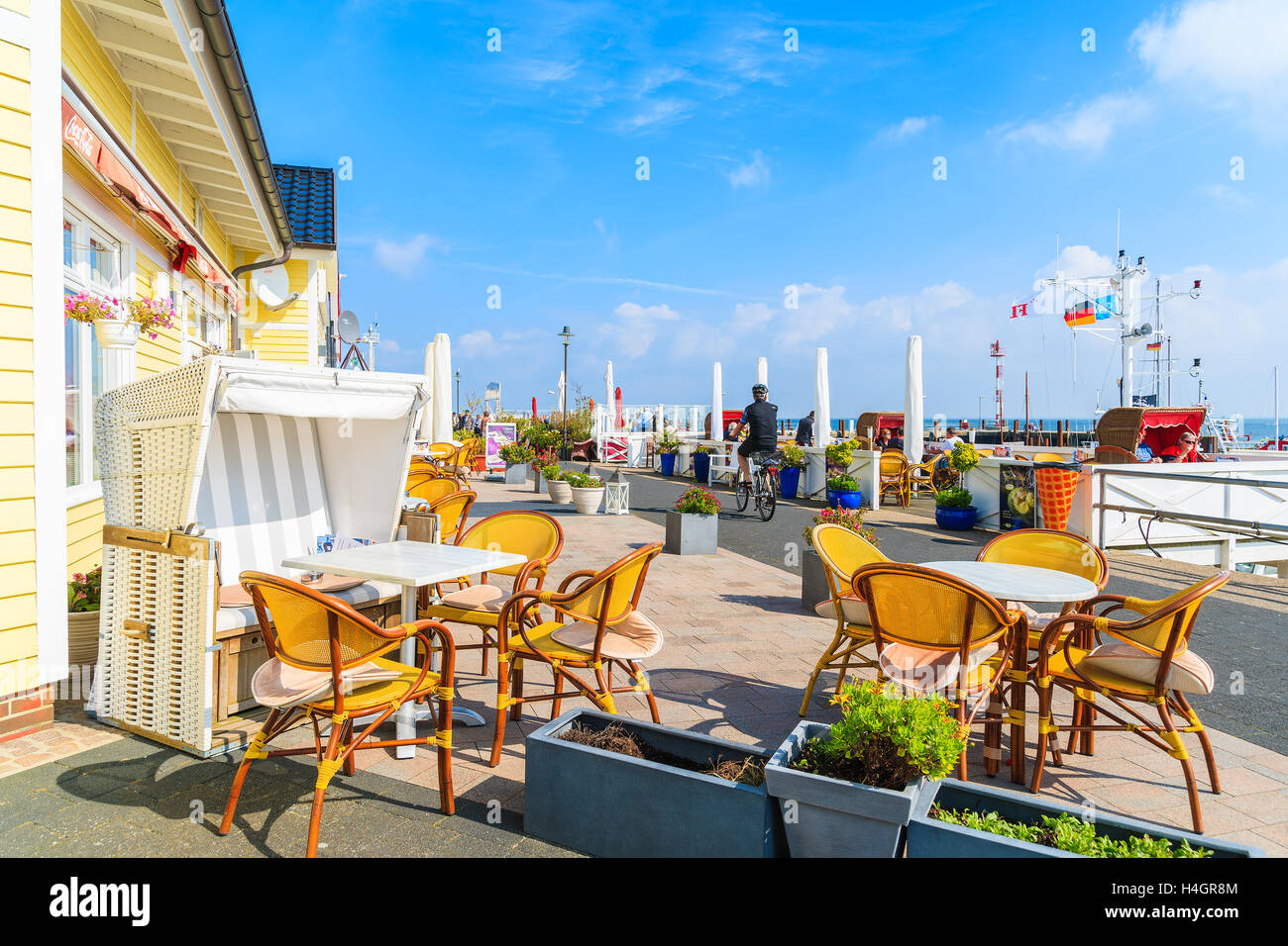 SYLT ISLAND, GERMANY - SEP 6, 2016: restaurant tables in List port on northern coast of Sylt island, Germany. Stock Photo