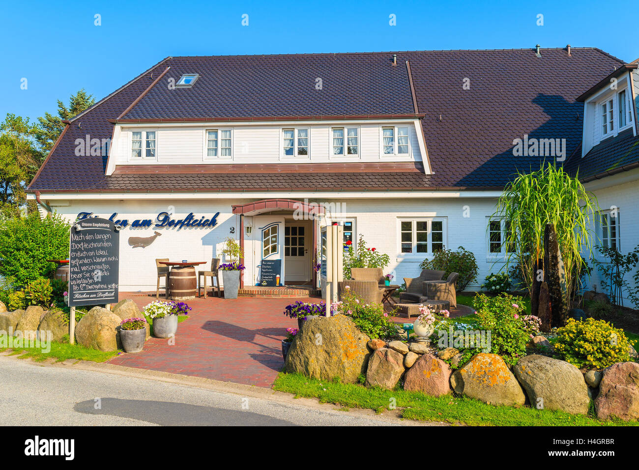 SYLT ISLAND, GERMANY - SEP 7, 2016: Typical restaurant and guest house in Wenningstedt village on Sylt island, Germany. Stock Photo